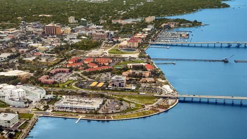 An aerial view of a city surrounded by water and bridges.