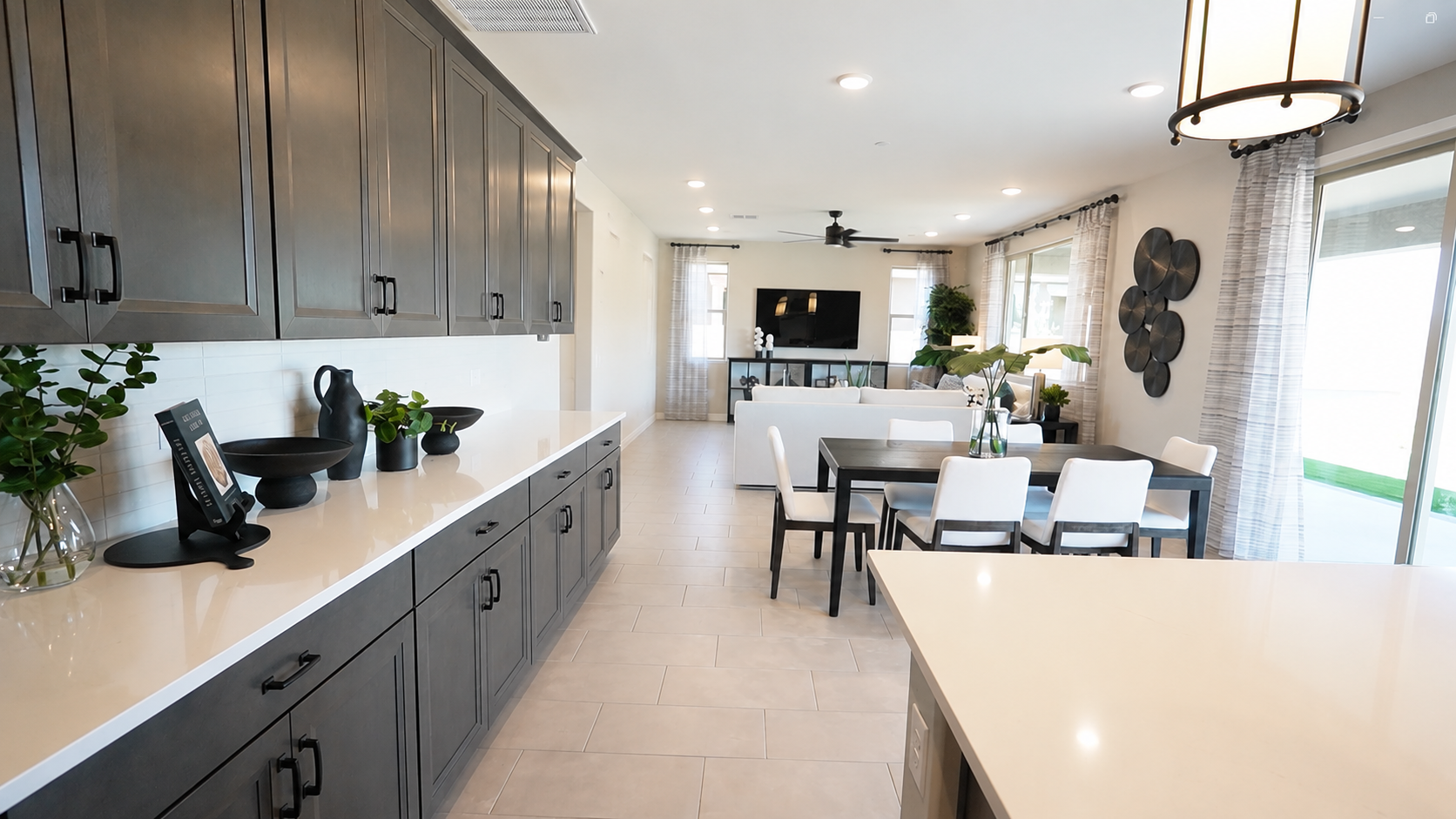 Ammolite floor plan's open kitchen and living spaces by Richmond American in Marana, AZ