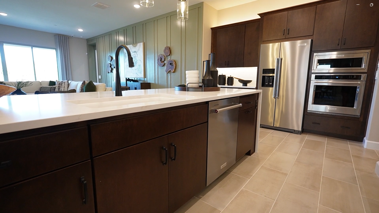 Gourmet kitchen with a 10-foot island - Hibiscus by Mattamy Homes at Tavira, Twin Peaks, Marana AZ