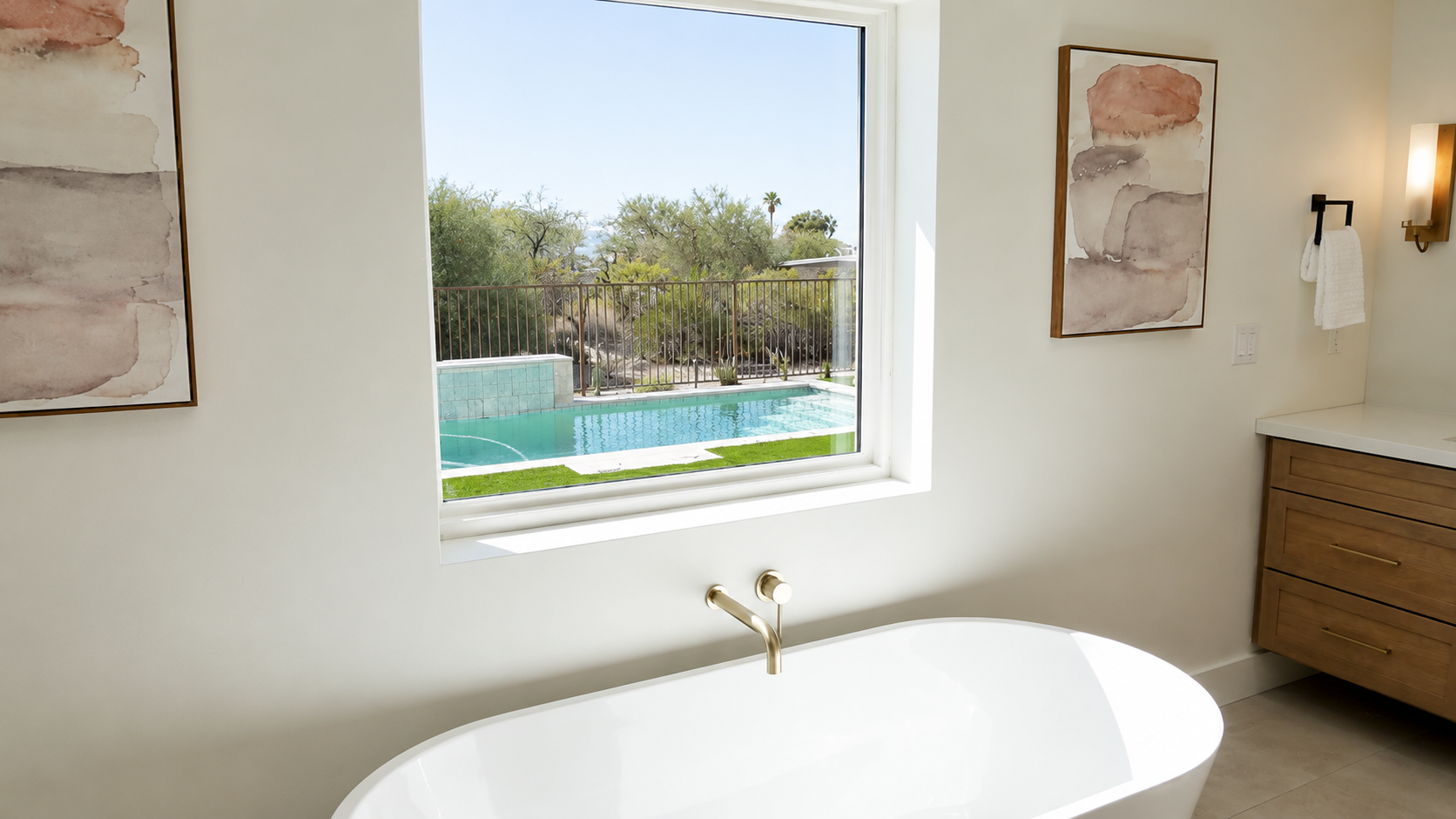 Relax in a spa-like bathroom overlooking your own private backyard pool in Catalina Foothills, Arizona