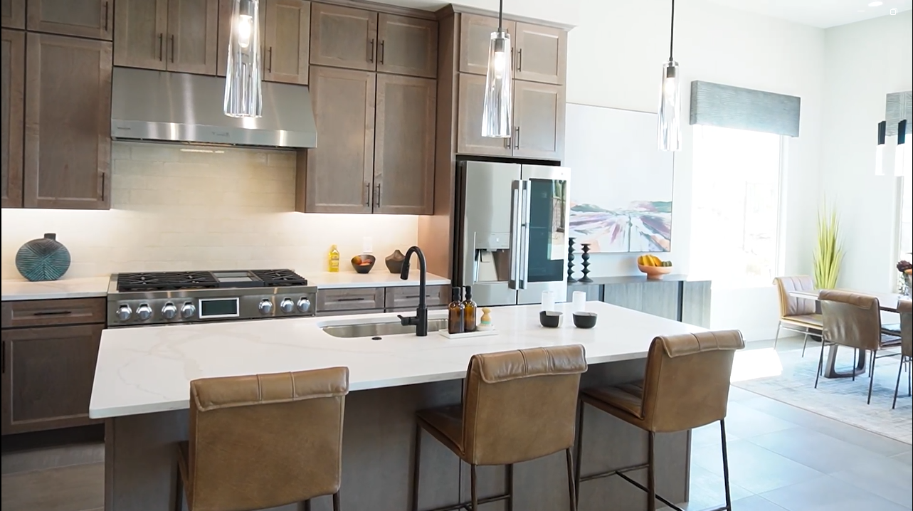 Upgraded gourmet kitchen with extended island by Fairfield Homes, Acacia model