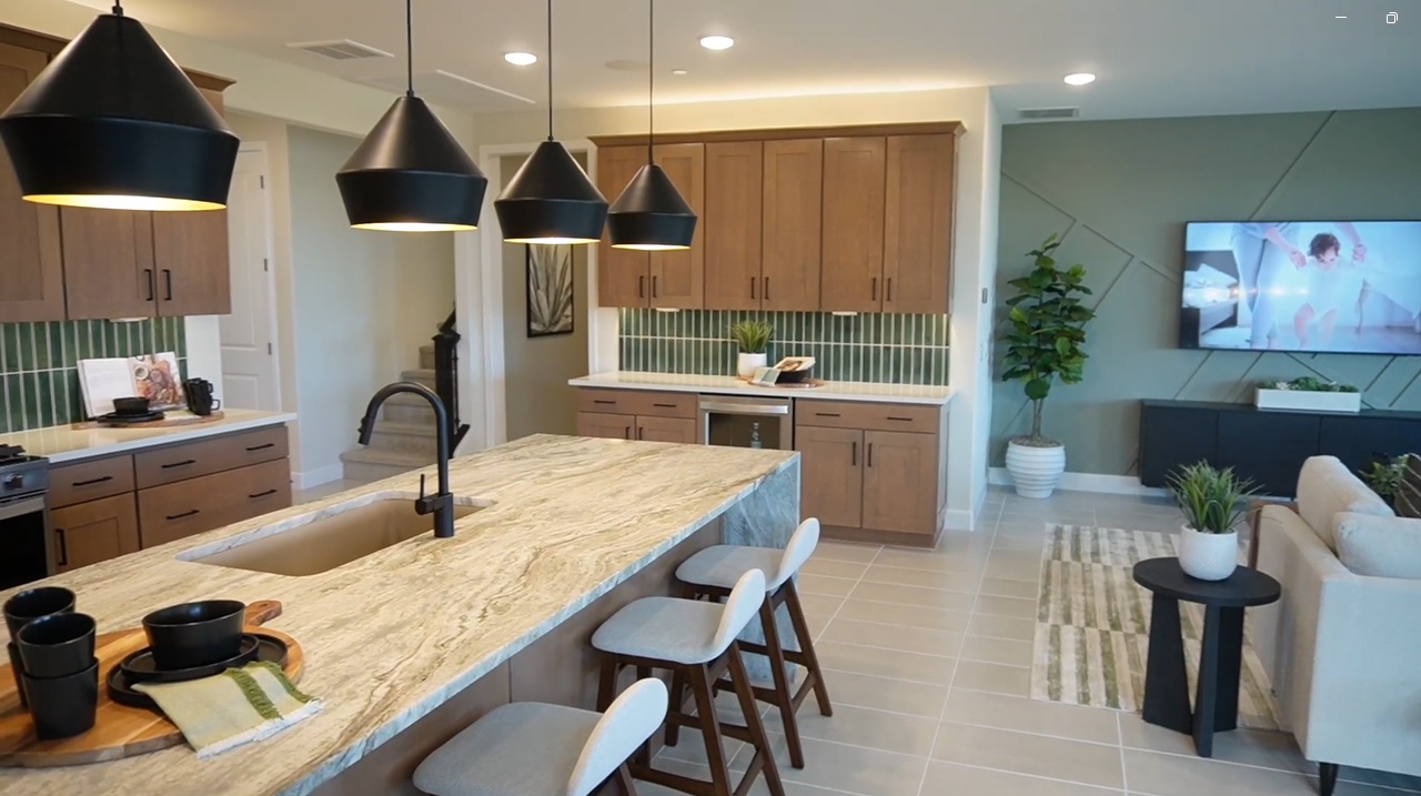 Inside Mattamy Homes' Slate floor plan in Marana, AZ - Chef's kitchen and living space