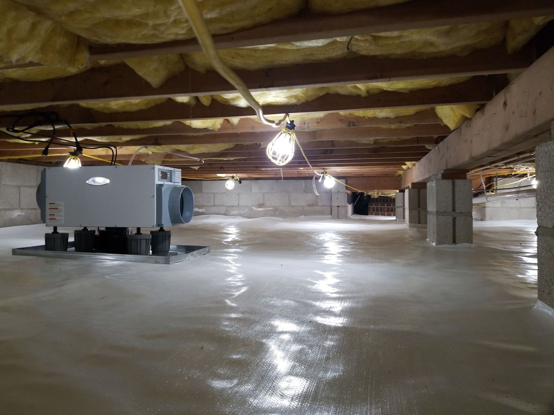 Lowcountry Crawlspaces installing a crawl space vapor barrier and encapsulation for a Charleston builder