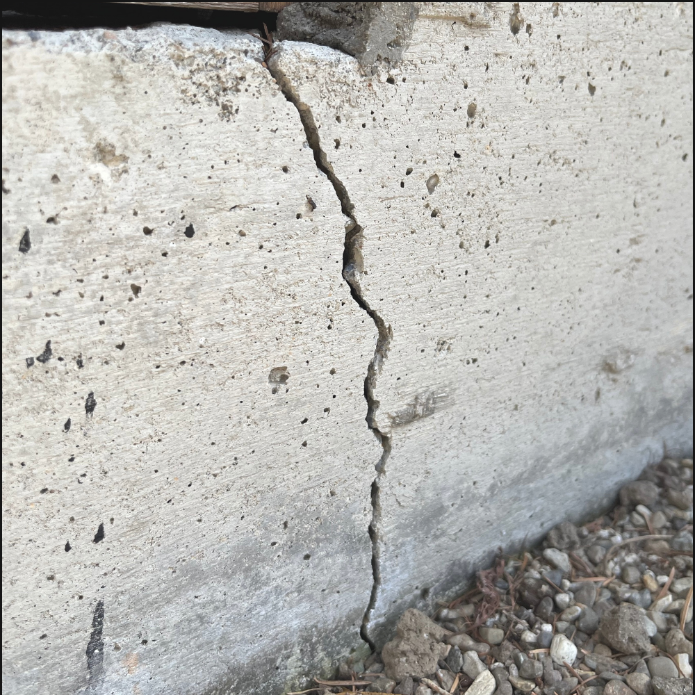 Foundation crack on a Charleston home indicating crawlspace vulnerability before hurricane season