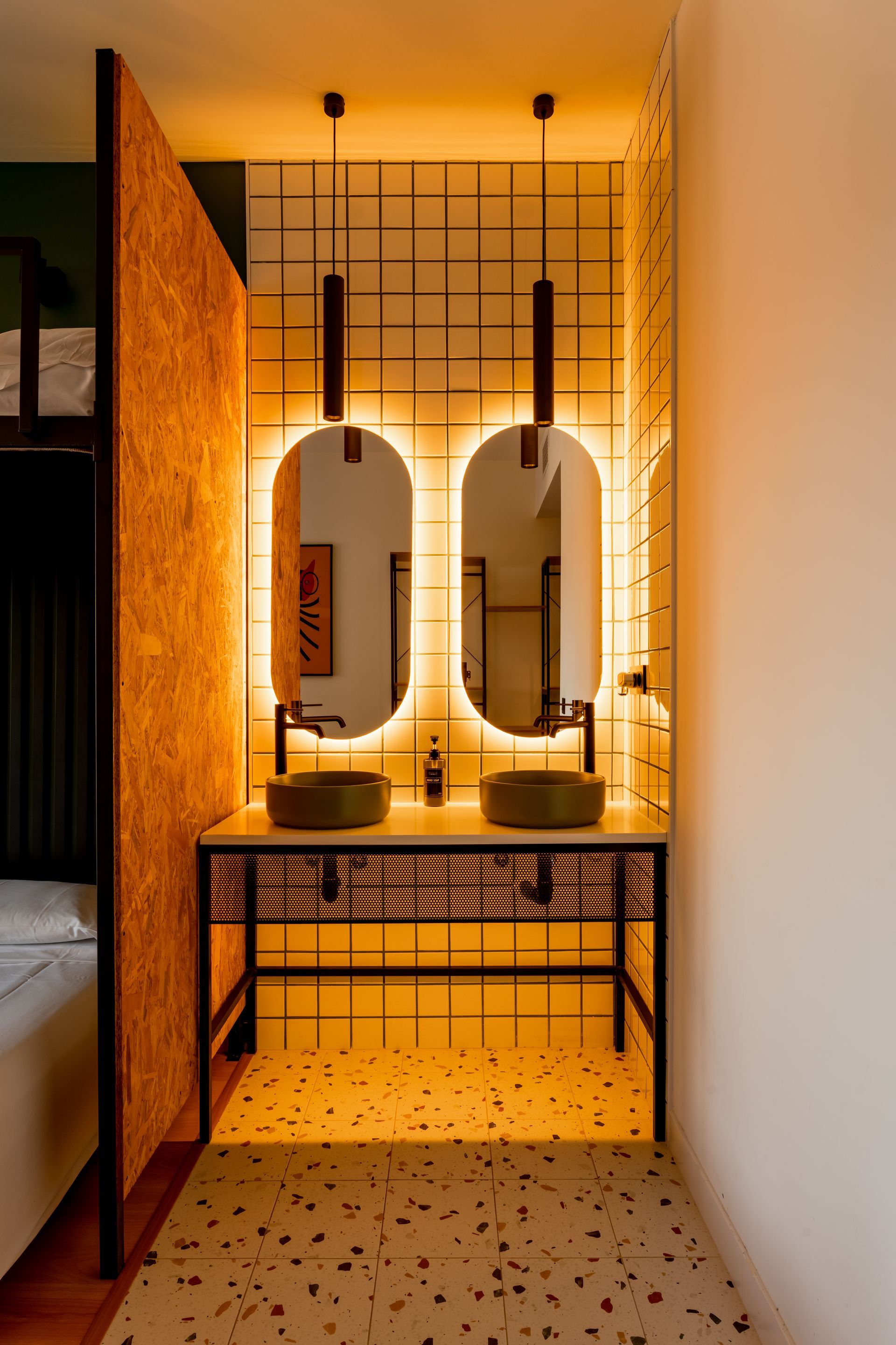 A bathroom with two sinks and two mirrors.