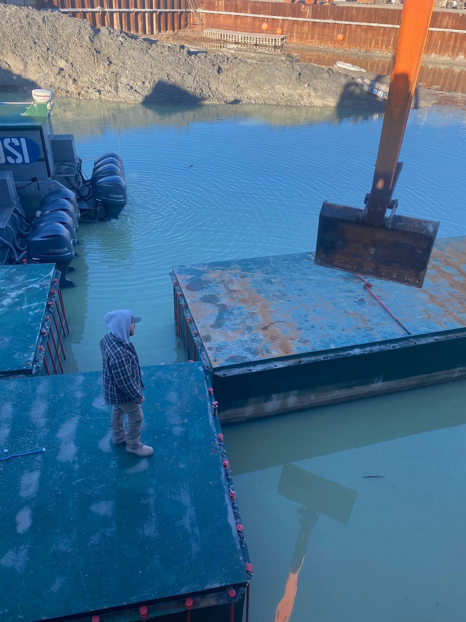Mining contractors loading aggregate near river staging area in Idaho.