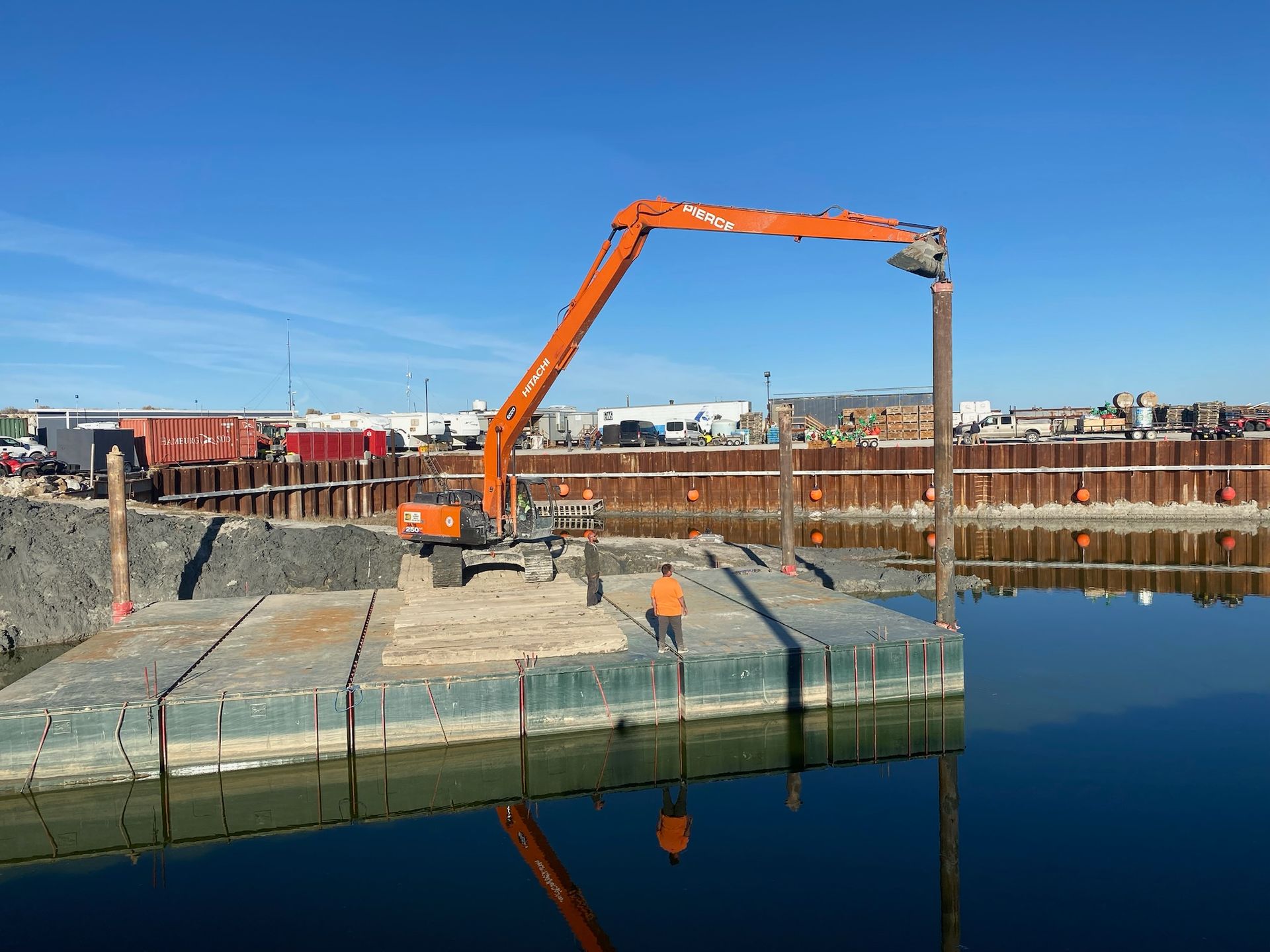 Mining contractors loading aggregate near river staging area in Idaho.