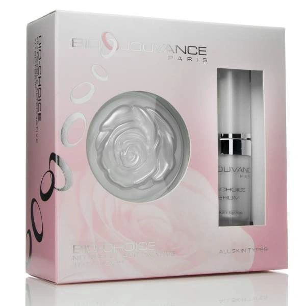 Pink and silver perfume gift set box with circular flower detail and bottle visible inside