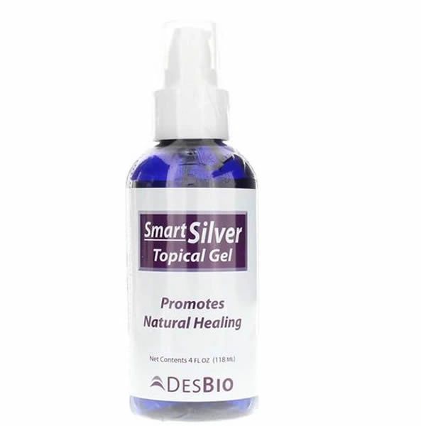 Blue bottle of Smart Silver topical gel with white spray cap and label reading “Promotes Natural Healing”