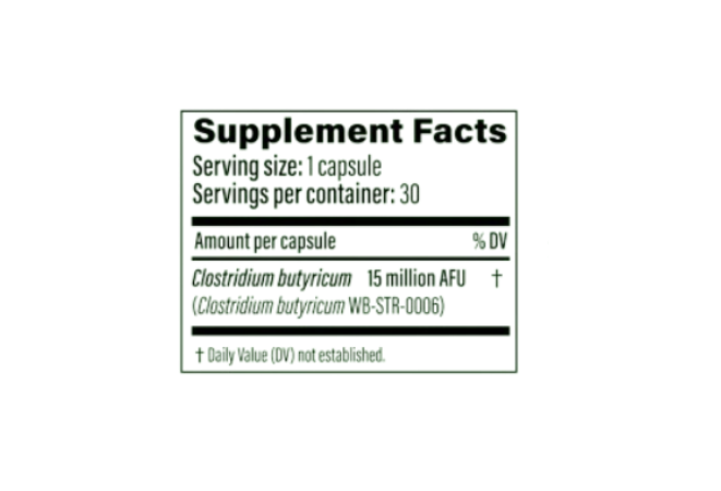 Green bottle of Pendulum Butyricum probiotic supplement with black cap on a pale green background