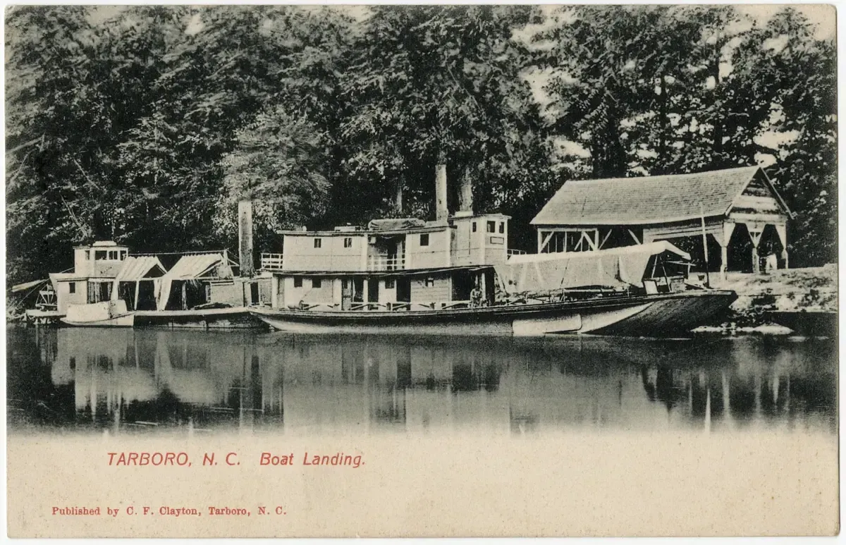 A vintage postcard showing a steamboat moored at the Boat Landing in Tarboro, North Carolina, with trees in the background.
