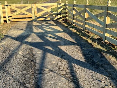 A wooden gate is sitting on the side of a road. Clarksville, TN