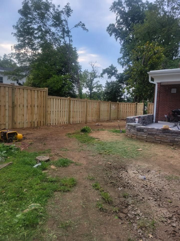 There is a wooden fence in the backyard of a house. Clarksville,TN