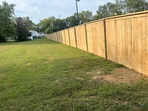 A wooden fence surrounds a lush green field. Clarksville,TN