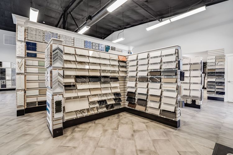 A store filled with lots of shelves filled with different types of tiles.