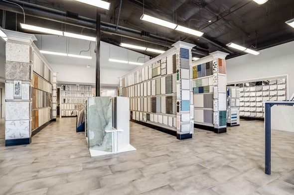 There are many different types of tiles on display in this store.