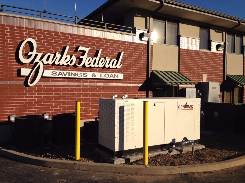 Garks Federal Savings & Loan brick building with sign and utility equipment outside