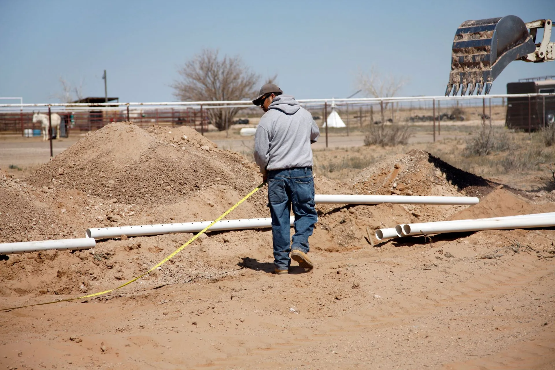 Man Measuring the Land