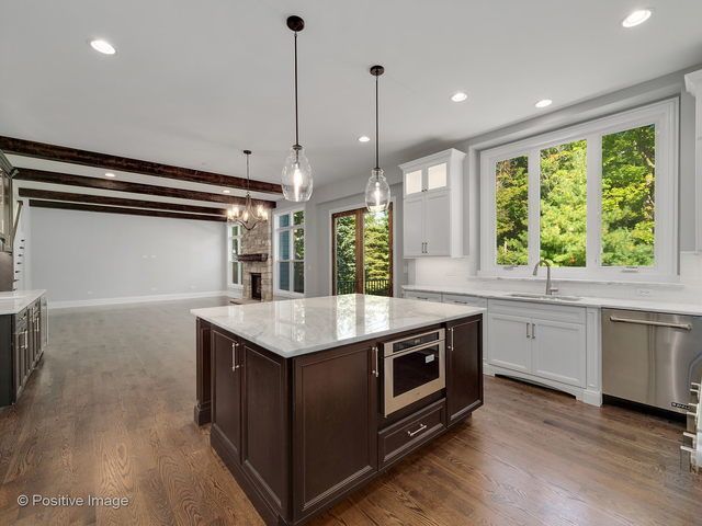 A kitchen with a large island in the middle of it