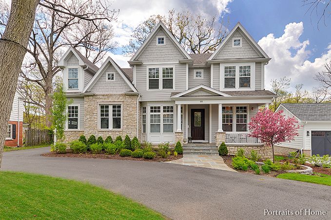 A large house with a lot of windows is for sale