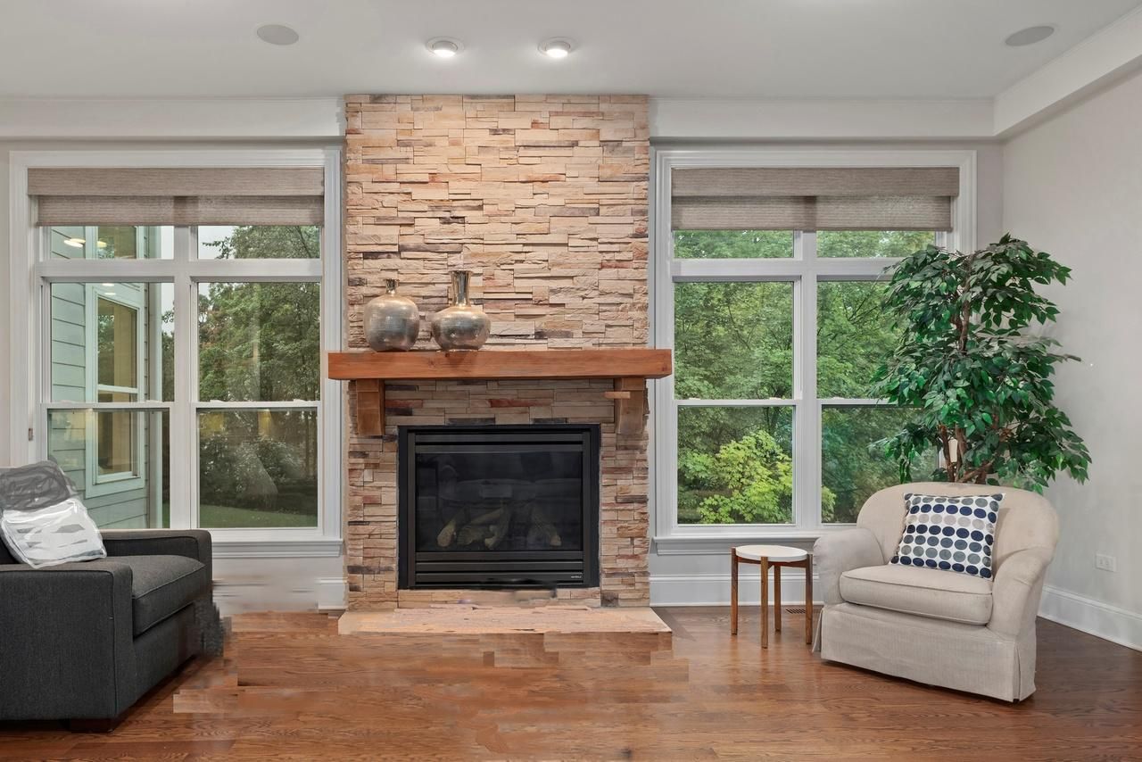 There is a fireplace in the middle of the living room.