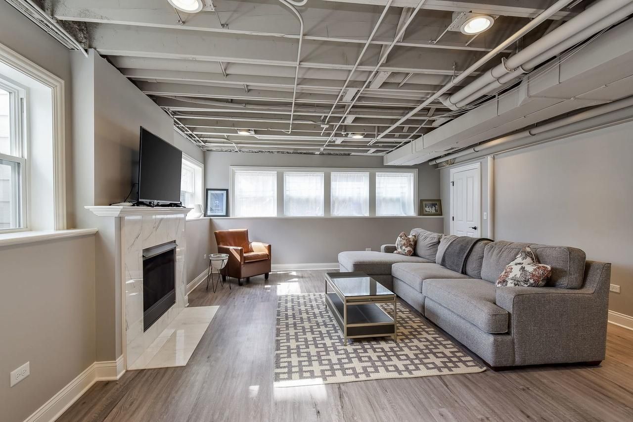 A living room with a couch and a fireplace
