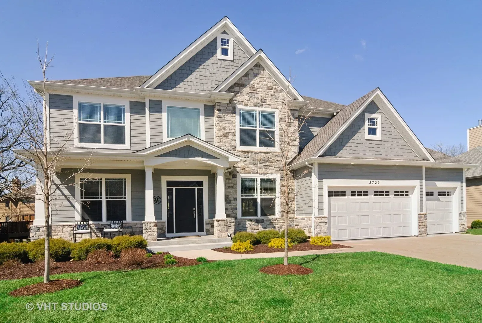 A large house with a lot of windows is for sale