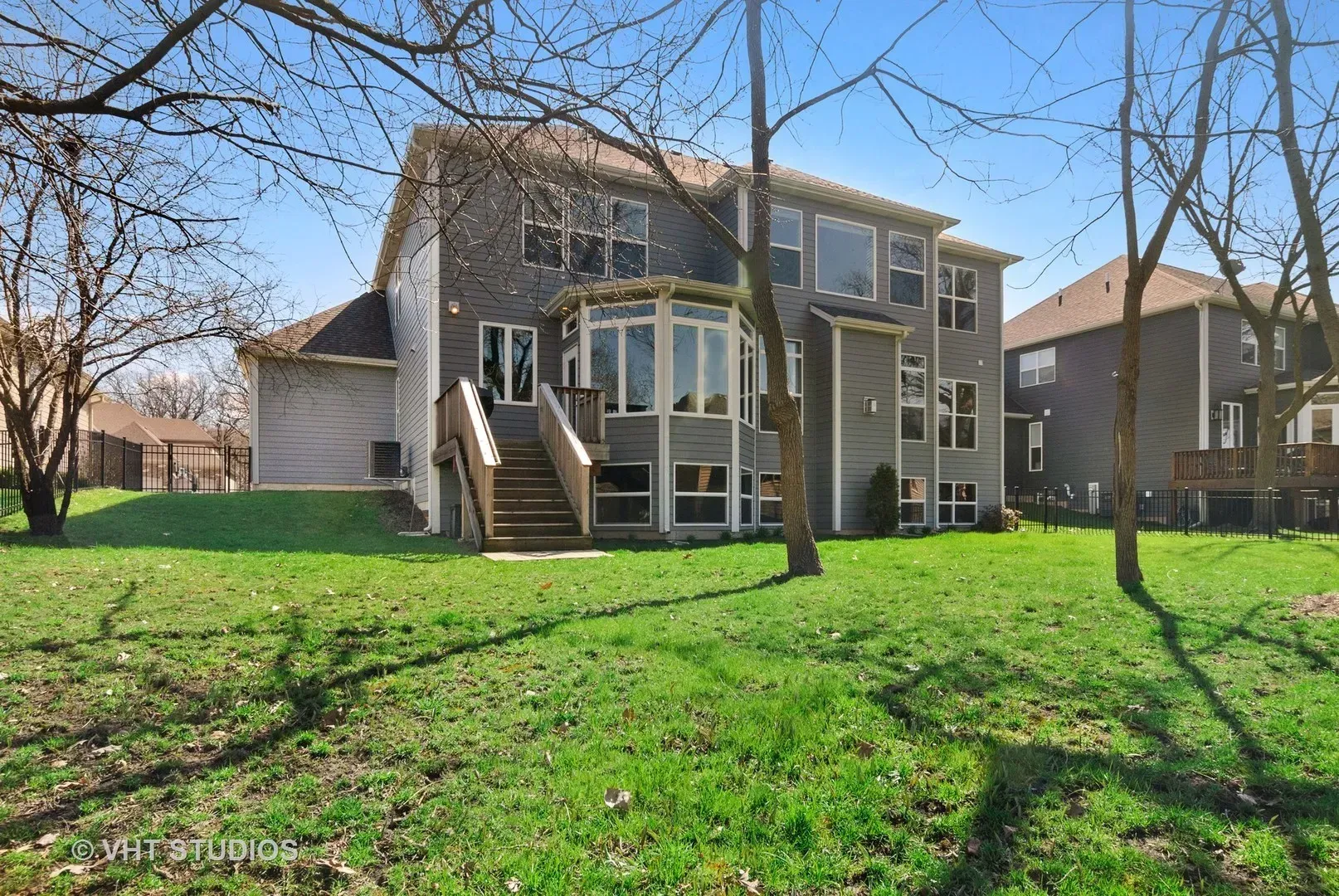 A large house with a large lawn in front of it