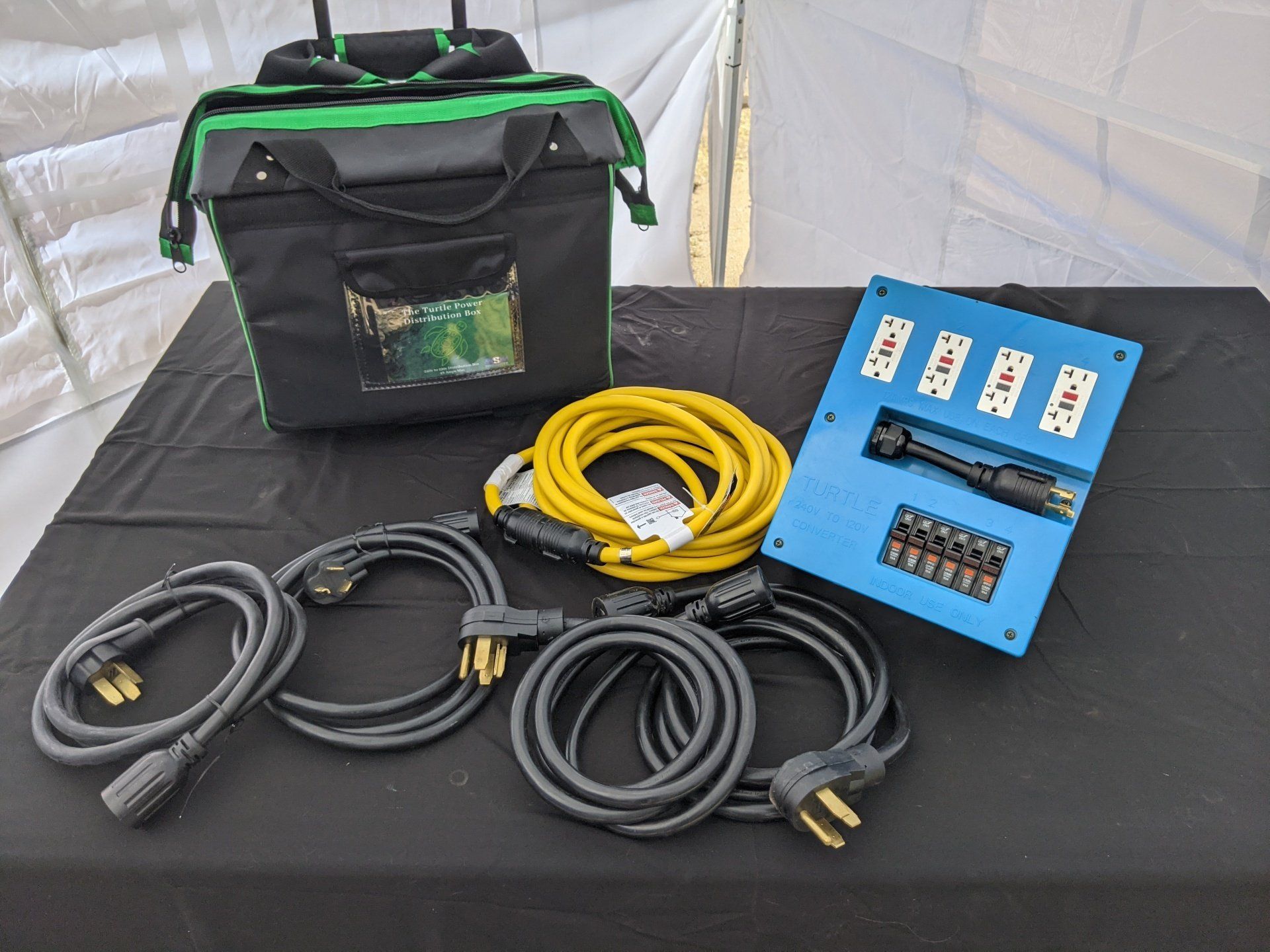 A bunch of wires are sitting on a table next to a bag