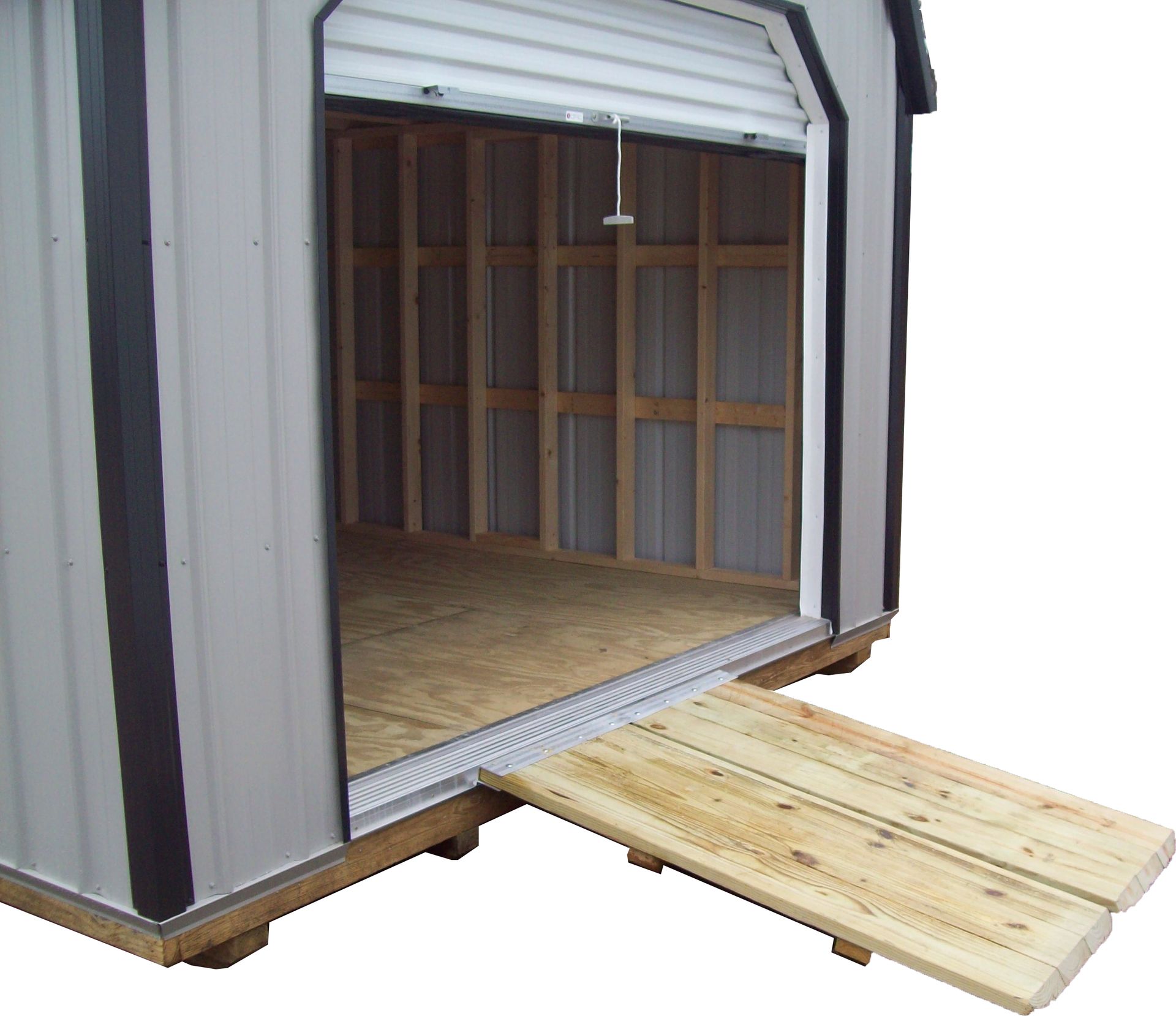 Small shed with an open doorway and a wooden ramp leading inside