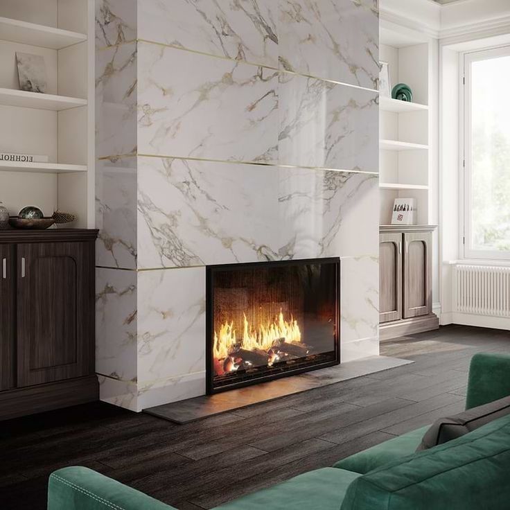 A living room with a fireplace and a green couch