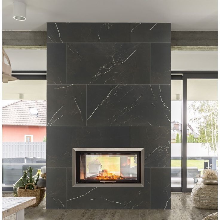 There is a fireplace in the middle of the room.