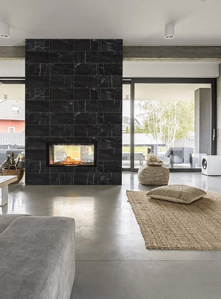 There is a fireplace in the middle of the living room.