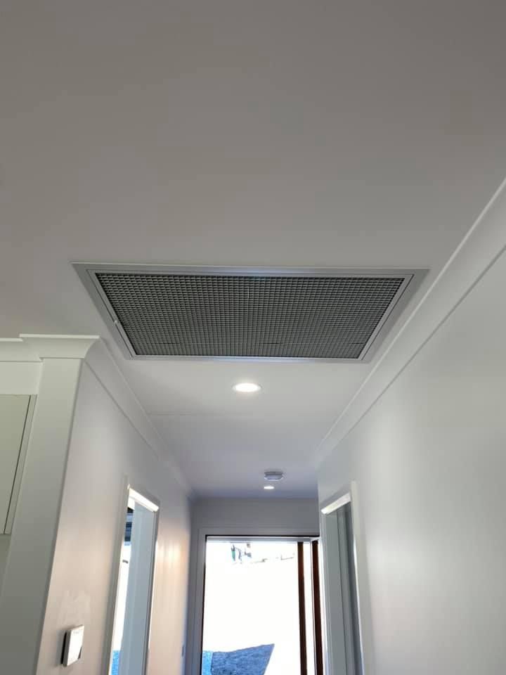 Ceiling Vent in a Hallway With White Walls and Trim, Overhead Lighting — Airset Air Conditioning in Nambucca, NSW