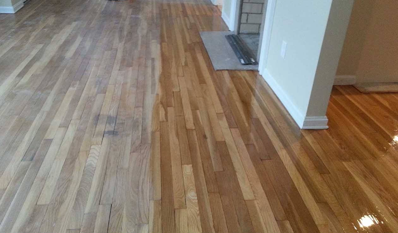 Sanded wooden floor with a floor buffer, creating polished wood.