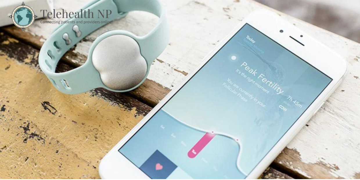A fertility tracking smartwatch next to a phone displaying fertility data.
