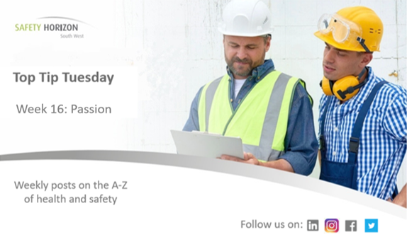 Two construction workers are looking at a piece of paper.