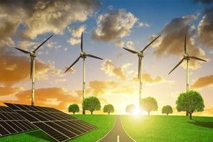 A road going through a field with solar panels and wind turbines.