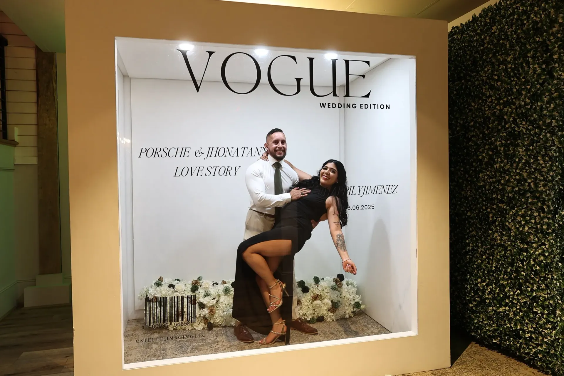 Vogue-branded display with a couple posing in a framed fashion photo booth