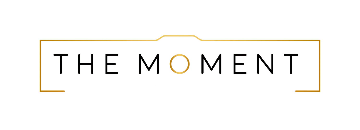 the logo for the moment portrait studio