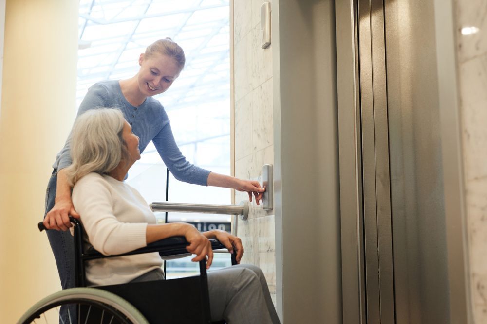 Carer Pressing Elevator Button for Disabled Elder — Adaptive Care Pty Ltd In Tarneit, VIC