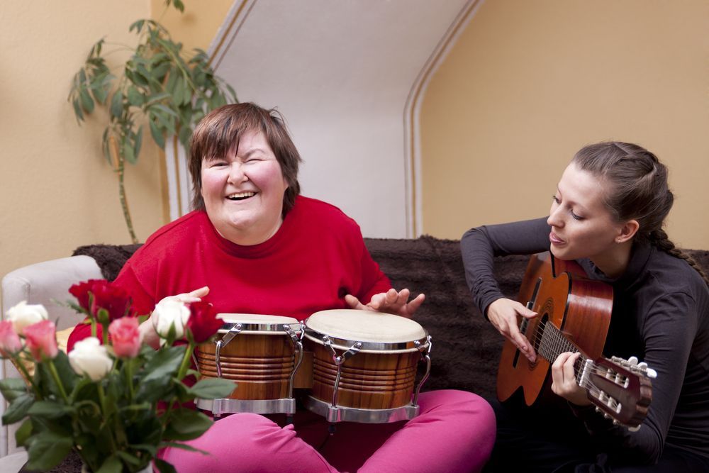 Two Women Joyfully Play Music Instruments — Adaptive Care Pty Ltd In Tarneit, VIC