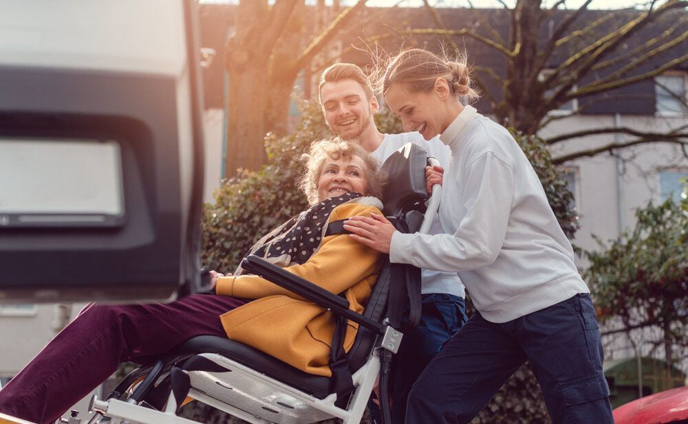 A Smiling Older Woman in a Wheelchair — Adaptive Care Pty Ltd In Pakenham, VIC