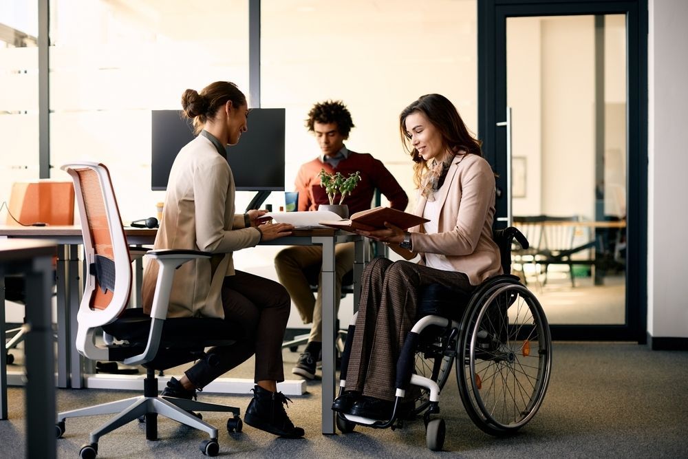 Two Women Are Engaged in a Discussion — Adaptive Care Pty Ltd In Pakenham, VIC
