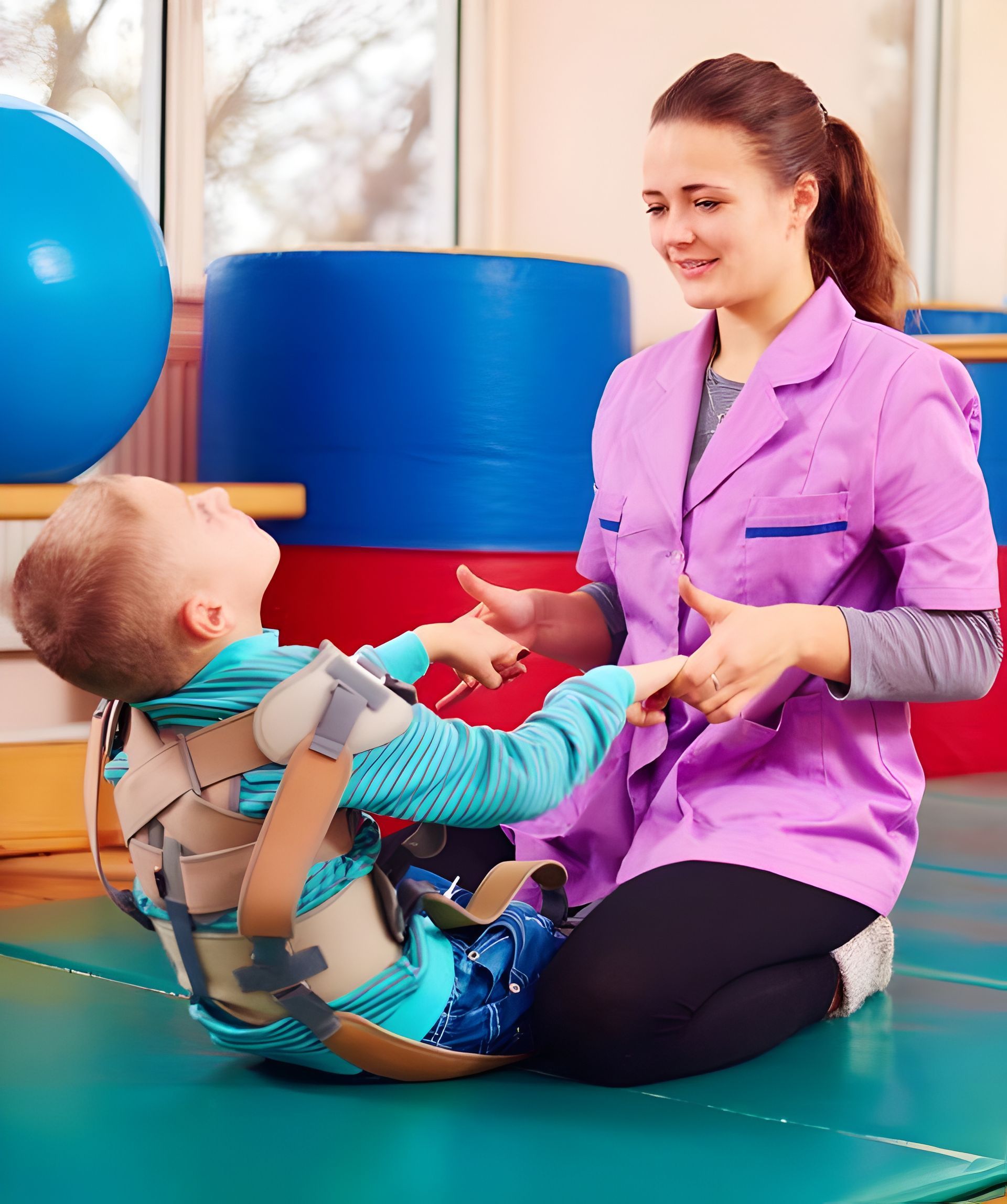 A Woman is Sitting on the Floor With a Child in a Brace  — Adaptive Care Pty Ltd In Tarneit, VIC