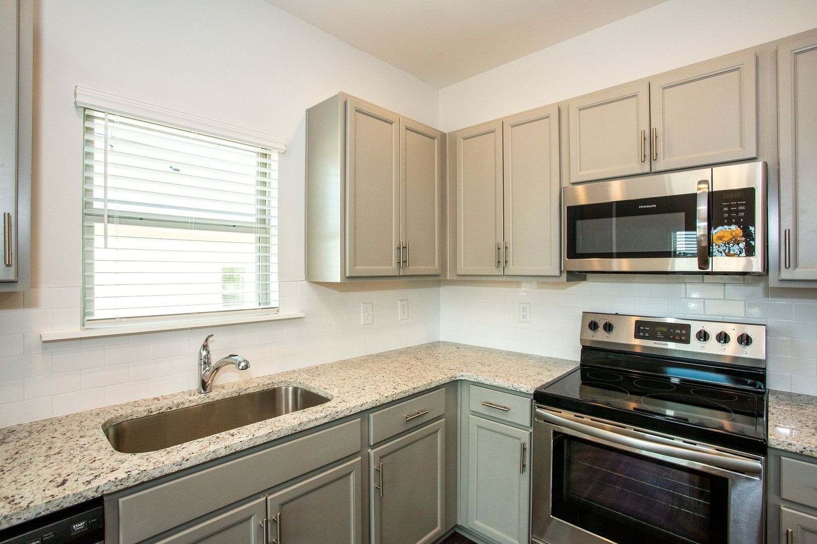 A kitchen in The Cottages on Weaver Avenue new home in Leeds Alabama