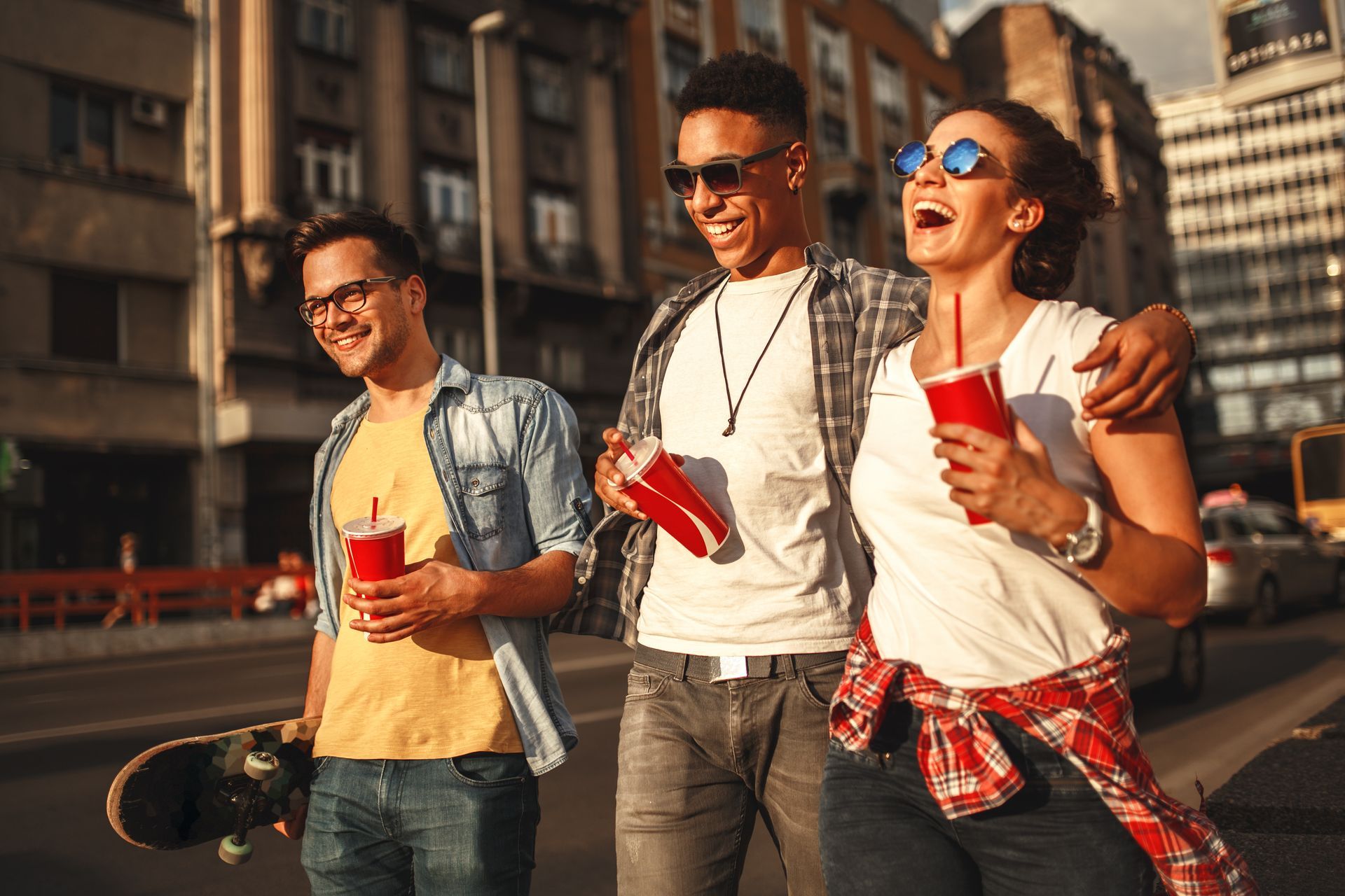 Three friends laughing as they walk in downtown Birmingham
