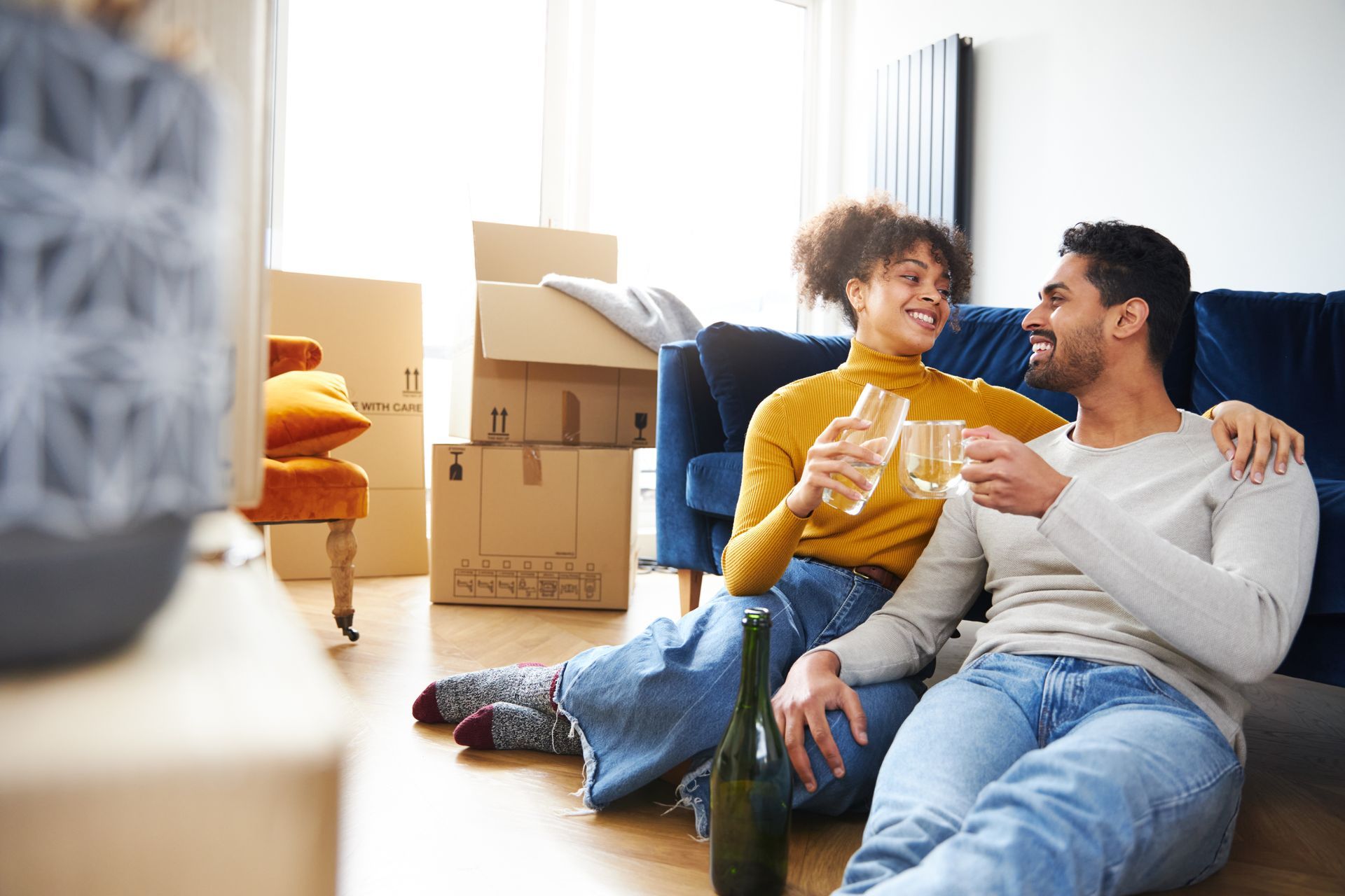 Happy couple moving into a new home.