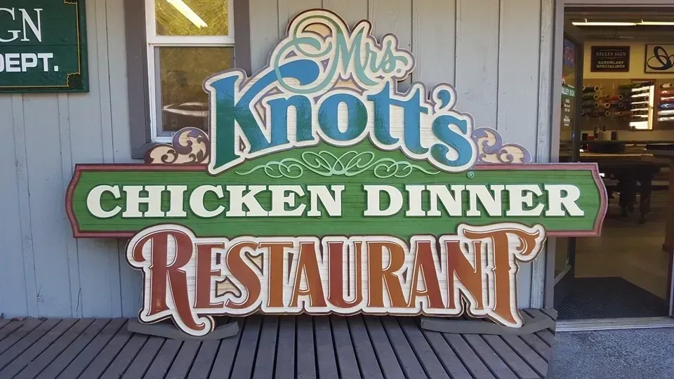 Mrs. Knott’s Chicken Dinner Restaurant sign on a wooden storefront