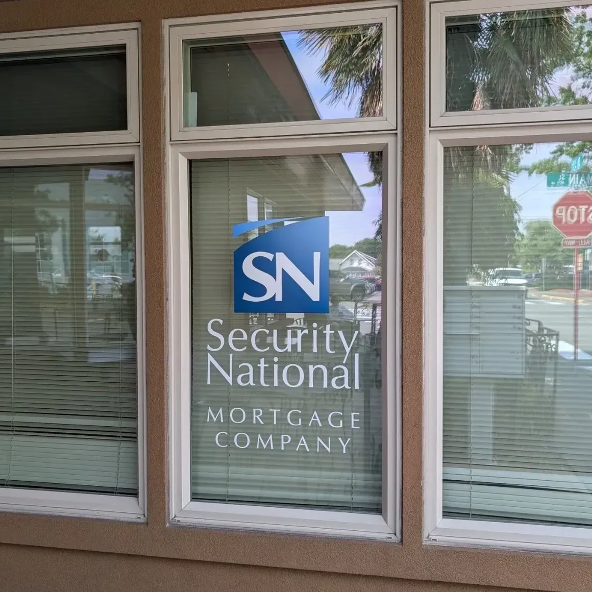 Security National Mortgage Company sign in a glass storefront window
